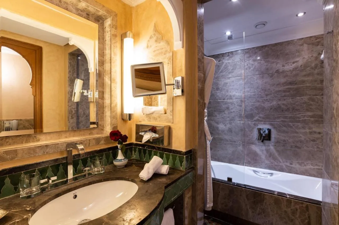 Bathroom with a bathtub — Palais Faraj Suites & Spa