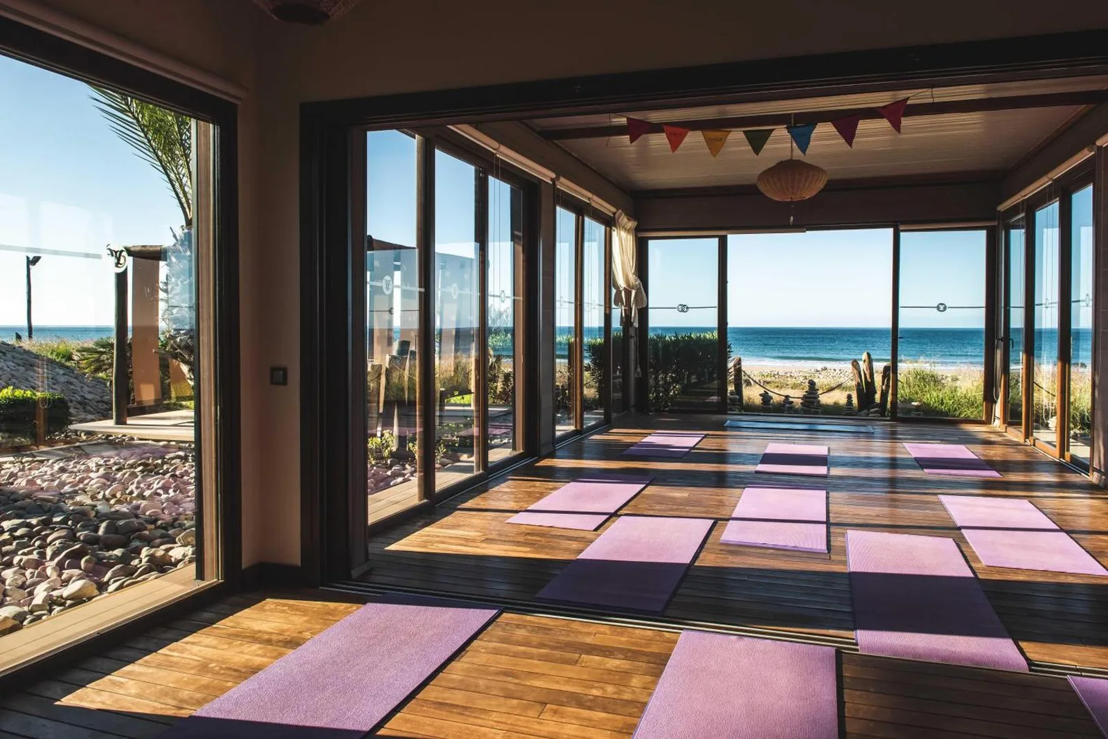 Yoga room opening onto the ocean — Paradis Plage Surf Yoga & Spa Resort