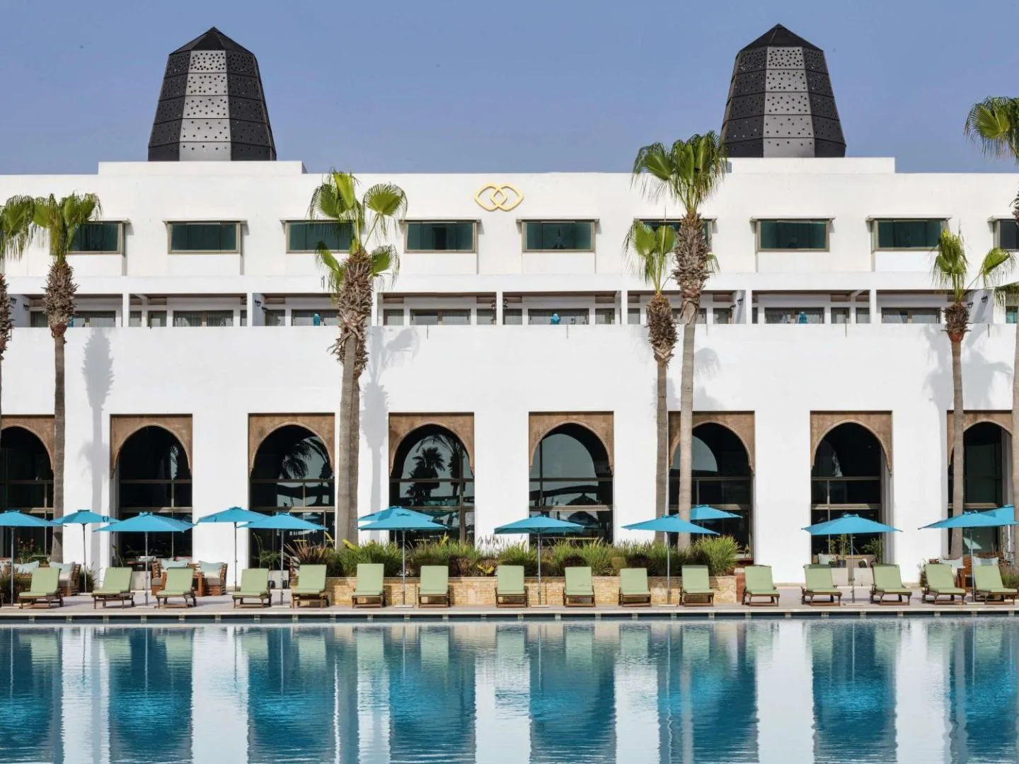 Arcaded façade beside the pool — Sofitel Agadir Royal Bay Resort