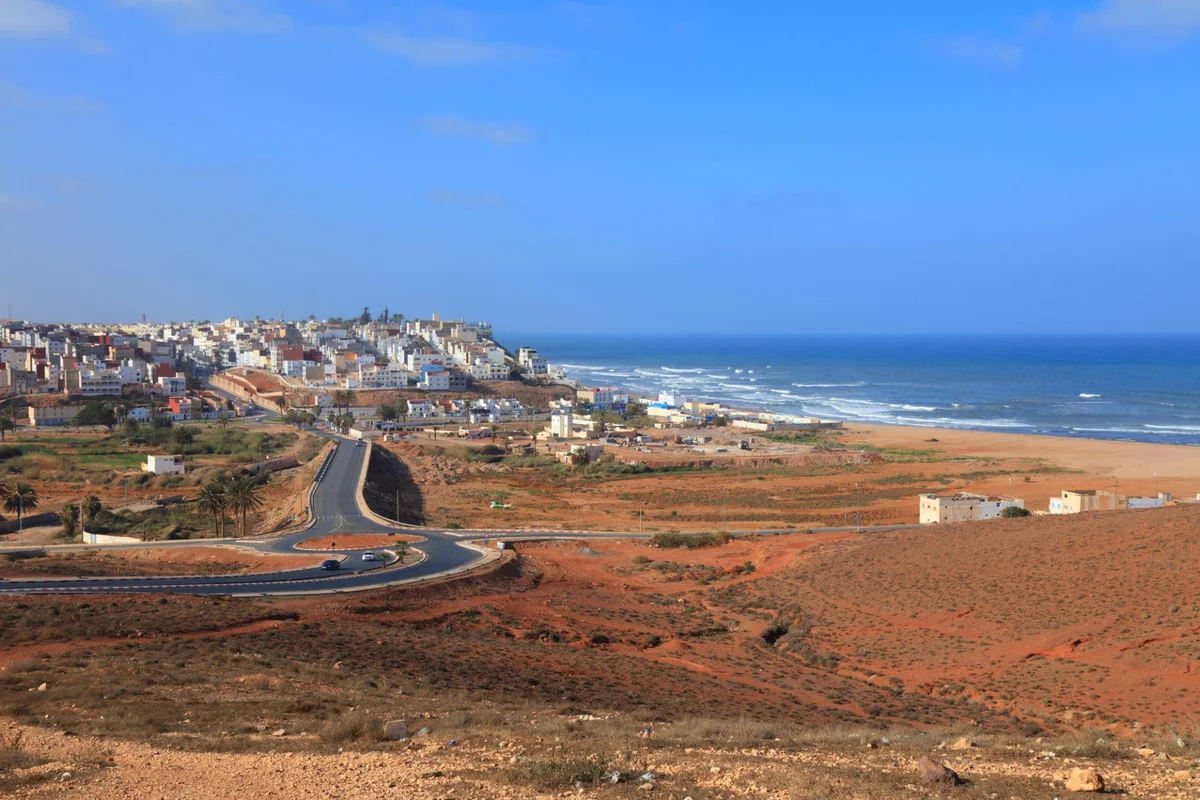 Panoramic view of Sidi Ifni, a coastal town in southern Morocco between the surrounding hills and the Atlantic Ocean.