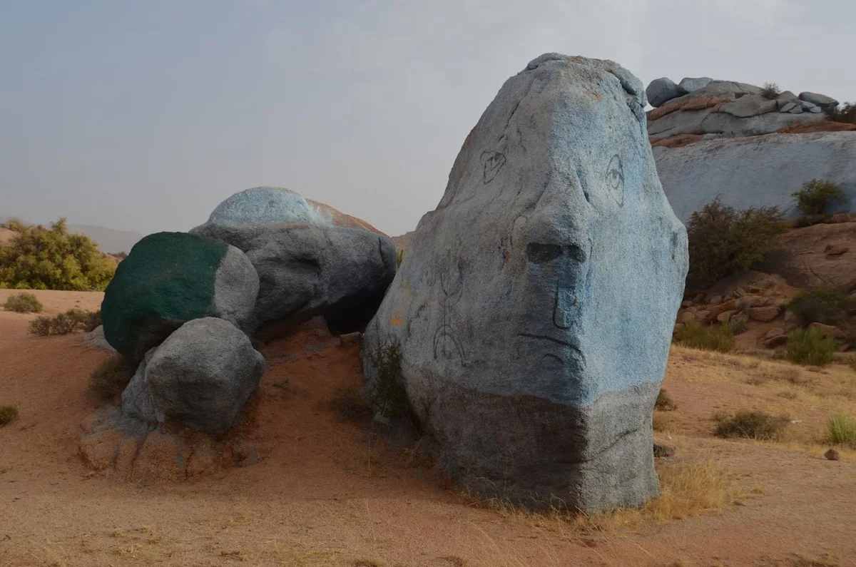 Blue and green painted rocks amid Tafraout’s granite landscape.